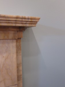 The marble fireplace in the lounge area looks so much better with a nice blue accent wall around it. Now to add that classy "be-sweatered" deer head...